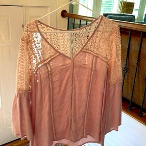 Size Large soft pink Bell sleeves. Never worn